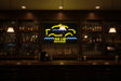 Neon sign for 'The Cab Bar & Grille' with yellow and blue design.