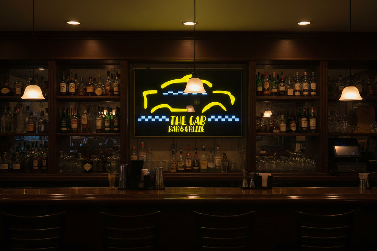 Neon sign for 'The Cab Bar & Grille' with yellow and blue design.